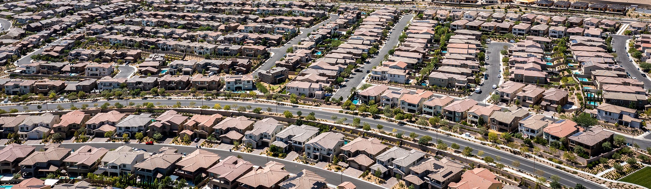 Aerial view of neighborhood with simi circle street in front.